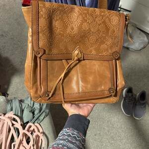 The Sak Ventura Convertible Brown Leather Backpack with Floral Emboss